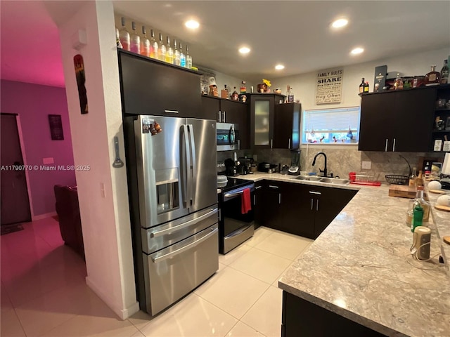 8297 NW 12th Pl, Miami, FL 33147 - kitchen with appliances with stainless steel finishes, a sink, light countertops, decorative backsplash, and recessed lighting