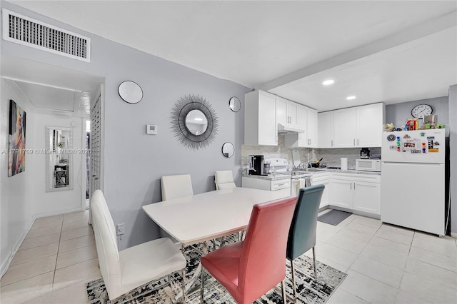 dining space with recessed lighting, light tile patterned flooring, and visible vents