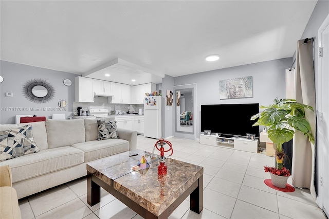living room featuring light tile patterned floors and recessed lighting