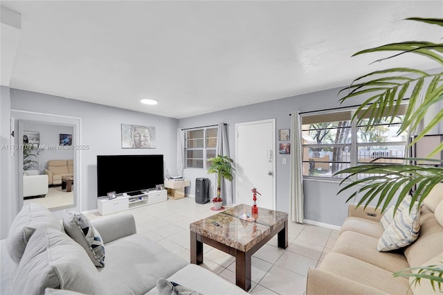 1851 NE 168th St Unit A8, North Miami Beach, FL 33162 - living area featuring light tile patterned floors and baseboards