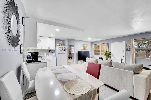 dining room featuring recessed lighting