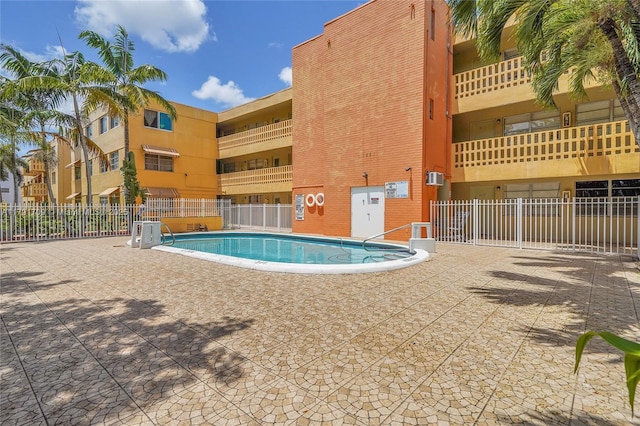 community pool featuring fence