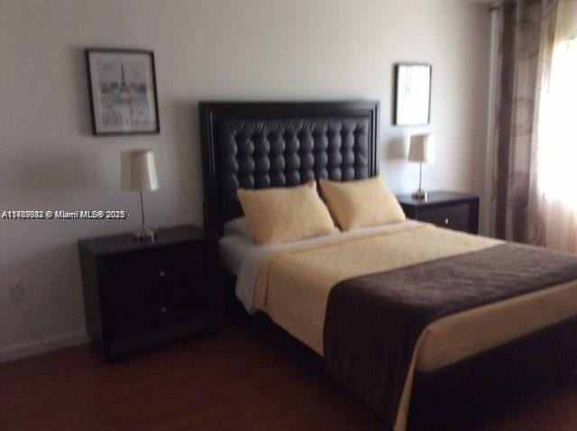 200 178th Dr Unit 504, Sunny Isles Beach, FL 33160 - bedroom with wood finished floors and baseboards