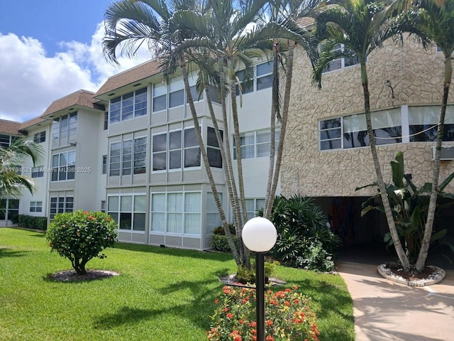 4805 NW 35th St Unit 610, Lauderdale Lakes, FL 33319 - view of apartment building / complex