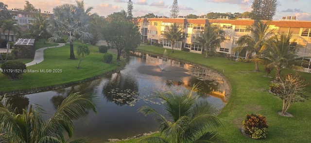 4805 NW 35th St Unit 610, Lauderdale Lakes, FL 33319 - view of property's community with a water view and a yard
