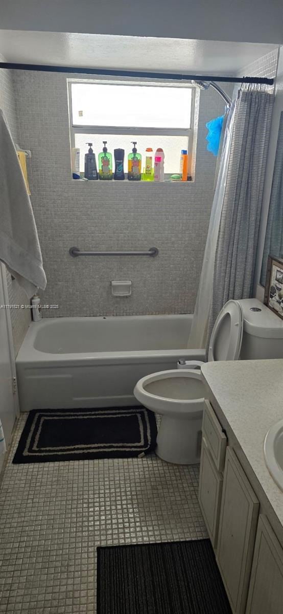 4805 NW 35th St Unit 610, Lauderdale Lakes, FL 33319 - full bathroom with shower / bath combo, vanity, and tile patterned floors
