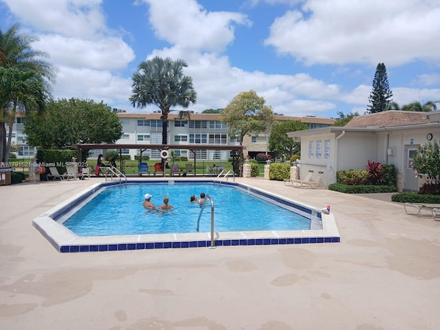 4805 NW 35th St Unit 610, Lauderdale Lakes, FL 33319 - community pool with a patio area