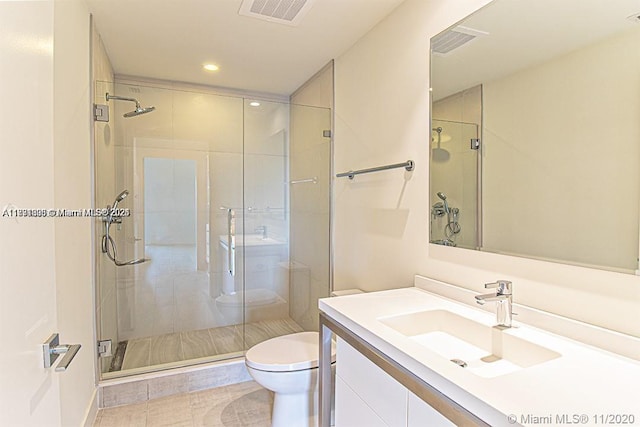 2000 Metropica Way Unit 614, Sunrise, FL 33323 - full bathroom with toilet, vanity, a stall shower, recessed lighting, and tile patterned flooring