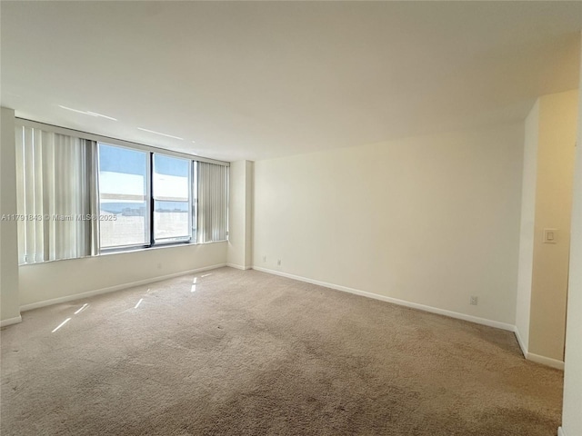 2500 Parkview Dr Unit 2004, Hallandale Beach, FL 33009 - spare room featuring light carpet and baseboards