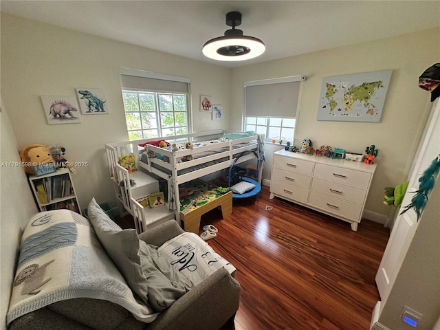 212 NE 3rd St Unit 12, Hallandale Beach, FL 33009 - bedroom with baseboards, multiple windows, a ceiling fan, and wood finished floors