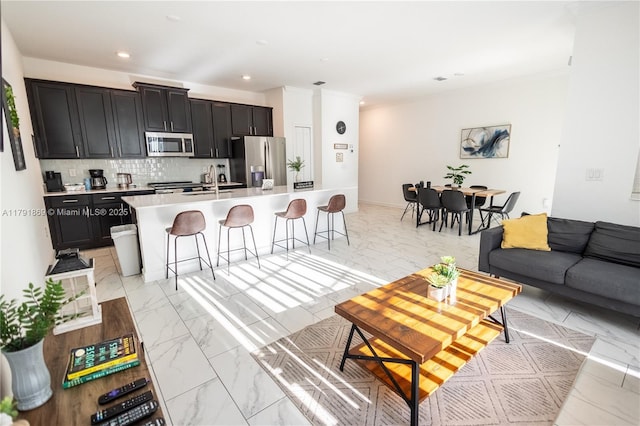 living room with recessed lighting and marble finish floor
