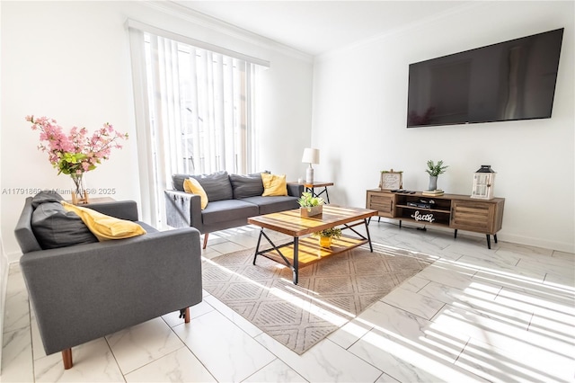 living area with ornamental molding, marble finish floor, and baseboards