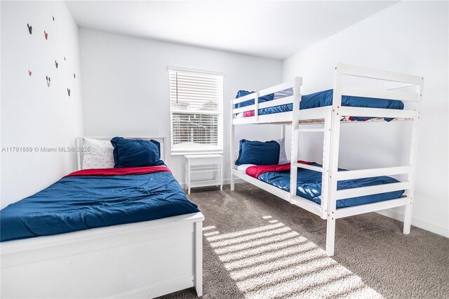 carpeted bedroom with baseboards