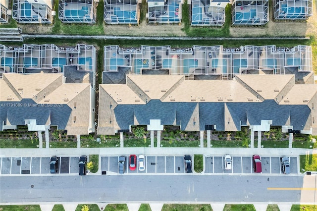 birds eye view of property with a residential view