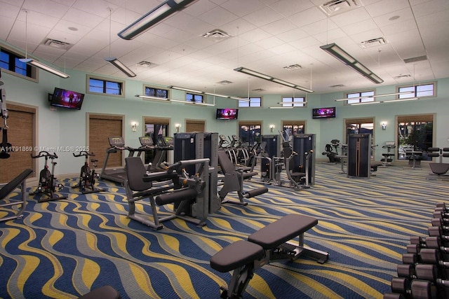 workout area featuring visible vents and carpet flooring