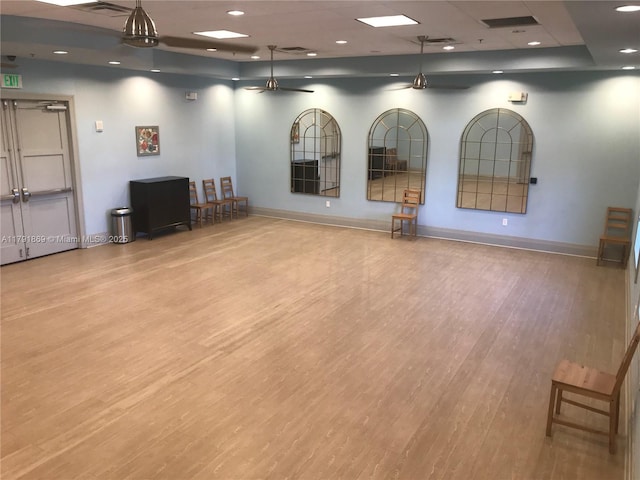 interior space featuring wood finished floors and baseboards