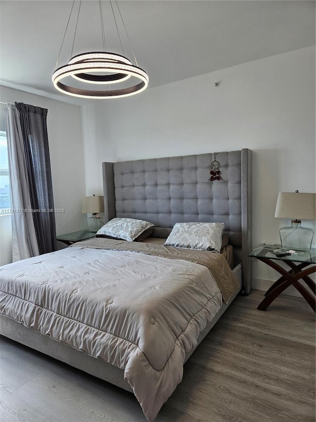 bedroom featuring wood finished floors