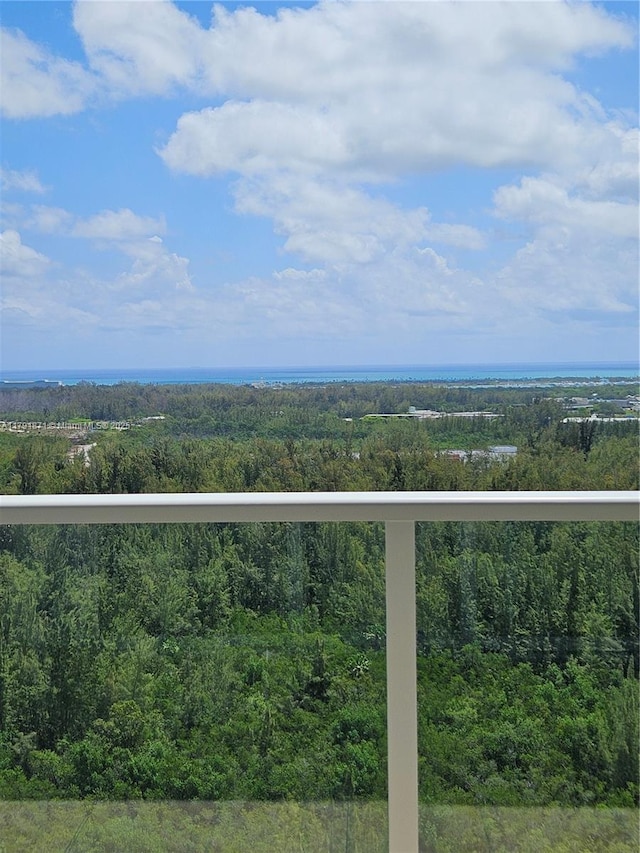 exterior space featuring a wooded view