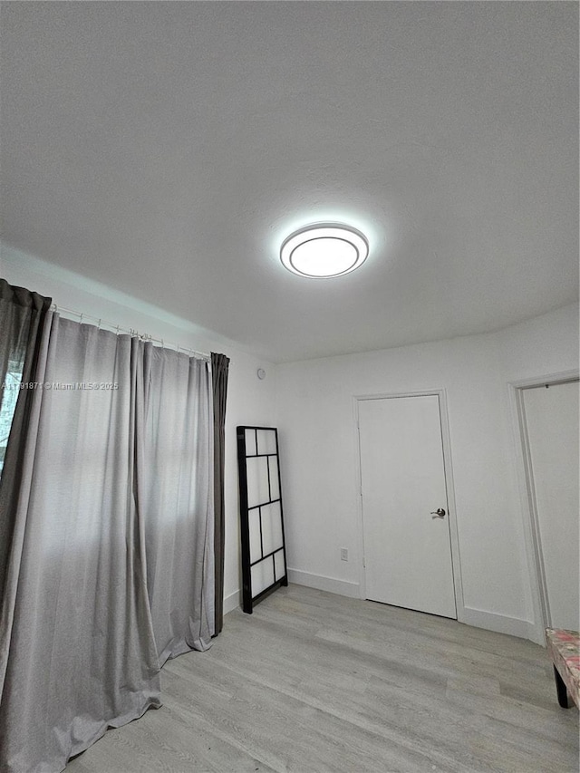 15051 Royal Oaks Ln Unit 2202, North Miami, FL 33181 - unfurnished room with light wood-type flooring and baseboards