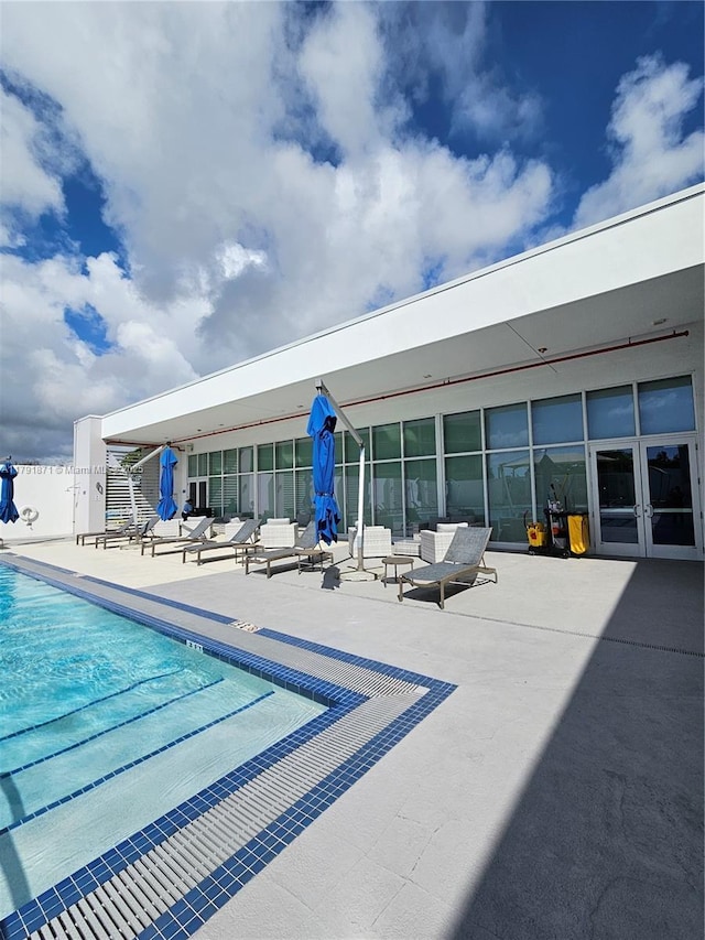 15051 Royal Oaks Ln Unit 2202, North Miami, FL 33181 - community pool featuring a patio area