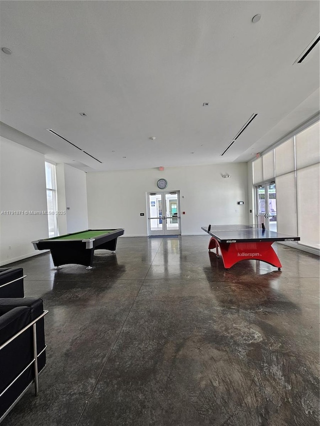 15051 Royal Oaks Ln Unit 2202, North Miami, FL 33181 - game room featuring billiards table, healthy amount of natural light, concrete floors, and french doors