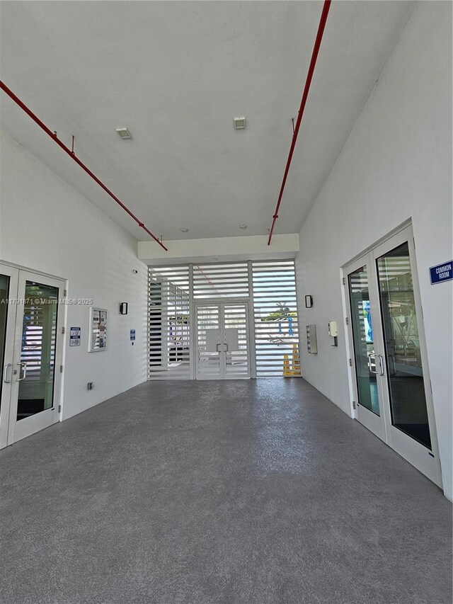 15051 Royal Oaks Ln Unit 2202, North Miami, FL 33181 - empty room with french doors