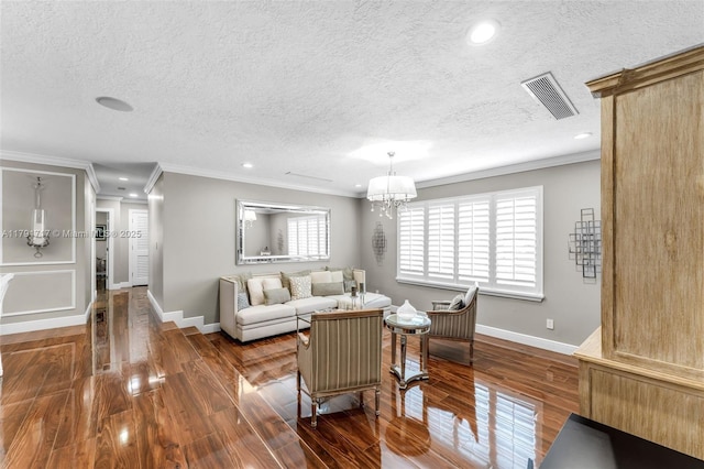 living area featuring visible vents, wood finished floors, a textured ceiling, and ornamental molding