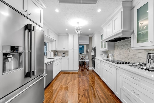kitchen featuring a sink, visible vents, light countertops, white cabinets, and appliances with stainless steel finishes