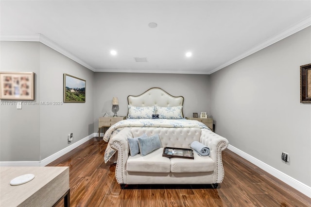 bedroom with crown molding, wood finished floors, and baseboards