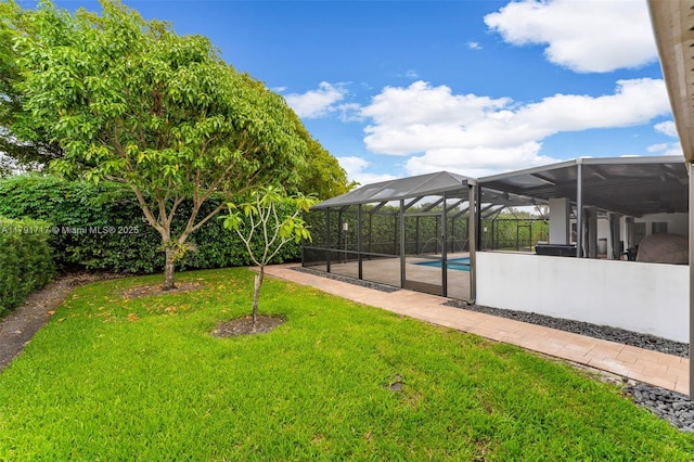 view of yard with an outdoor pool and glass enclosure