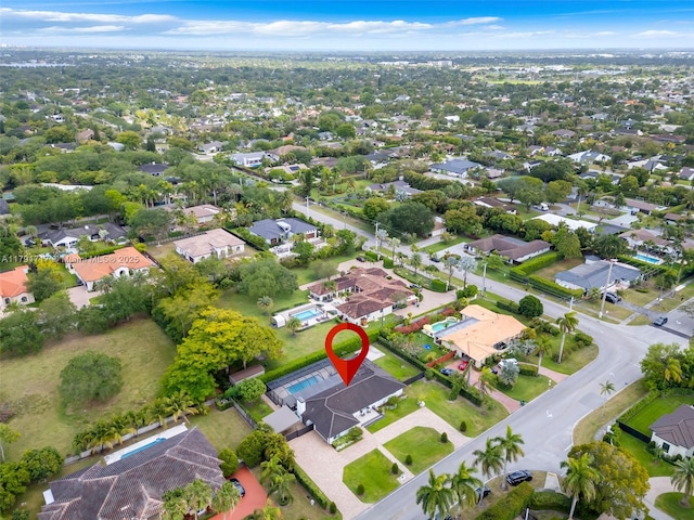 birds eye view of property with a residential view