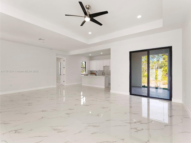 923 Winters St E, Lehigh Acres, FL 33974 - unfurnished living room featuring recessed lighting, a ceiling fan, and baseboards