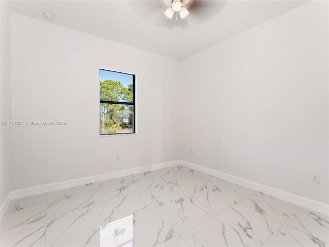 923 Winters St E, Lehigh Acres, FL 33974 - unfurnished room featuring baseboards, ceiling fan, and marble finish floor