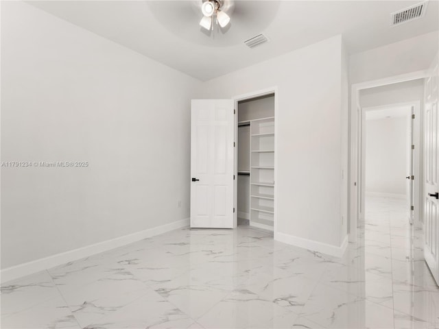 923 Winters St E, Lehigh Acres, FL 33974 - unfurnished bedroom featuring marble finish floor, visible vents, ceiling fan, and baseboards