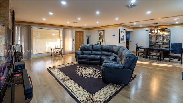 living room featuring visible vents, wood finished floors, ceiling fan, and recessed lighting
