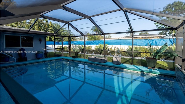 outdoor pool featuring a lanai and a water view