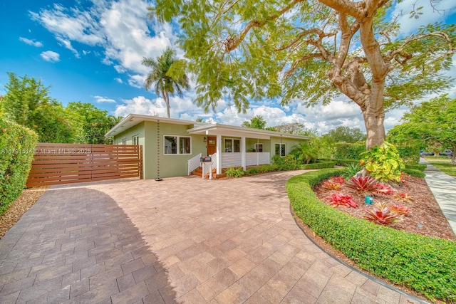 view of front of home with fence and stucco siding