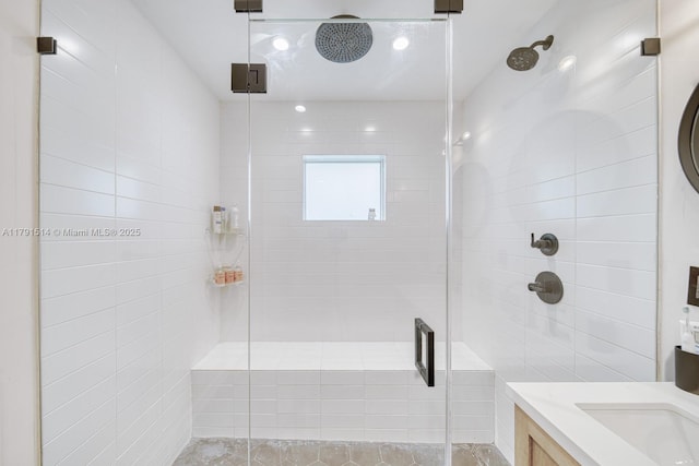 bathroom featuring vanity and a stall shower