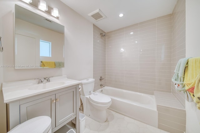 bathroom featuring shower / bath combination, visible vents, tile patterned flooring, vanity, and toilet