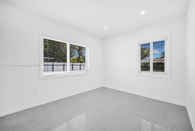 240 NW 127th St, North Miami, FL 33168 - spare room featuring baseboards and recessed lighting