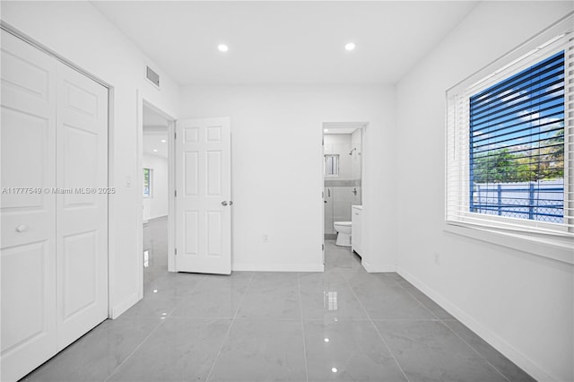 240 NW 127th St, North Miami, FL 33168 - unfurnished bedroom featuring recessed lighting, connected bathroom, a closet, baseboards, and visible vents