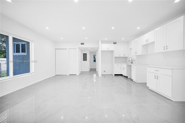 240 NW 127th St, North Miami, FL 33168 - unfurnished living room featuring baseboards, recessed lighting, and a sink