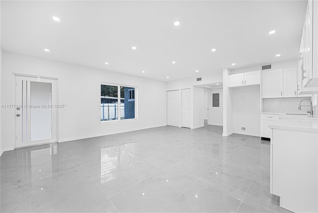 240 NW 127th St, North Miami, FL 33168 - unfurnished living room featuring recessed lighting, marble finish floor, a sink, and visible vents