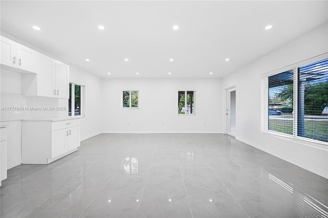240 NW 127th St, North Miami, FL 33168 - unfurnished living room featuring recessed lighting and baseboards