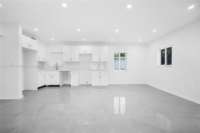 240 NW 127th St, North Miami, FL 33168 - unfurnished living room with recessed lighting, marble finish floor, and baseboards