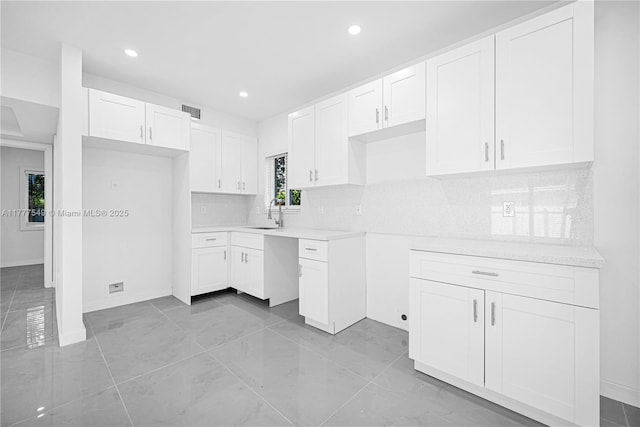 240 NW 127th St, North Miami, FL 33168 - kitchen with white cabinetry, visible vents, backsplash, and recessed lighting