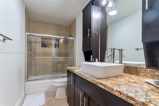 16720 SW 276th St, Homestead, FL 33031 - bathroom featuring tile patterned flooring, vanity, toilet, and combined bath / shower with glass door