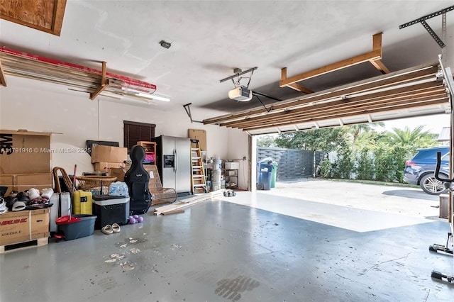 16720 SW 276th St, Homestead, FL 33031 - garage with stainless steel refrigerator with ice dispenser and a garage door opener