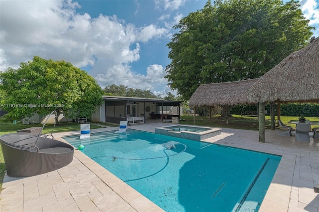 16720 SW 276th St, Homestead, FL 33031 - view of swimming pool featuring a gazebo, a sunroom, a patio, and a pool with connected hot tub