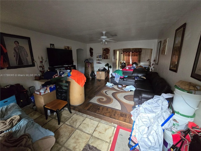 living area with a ceiling fan